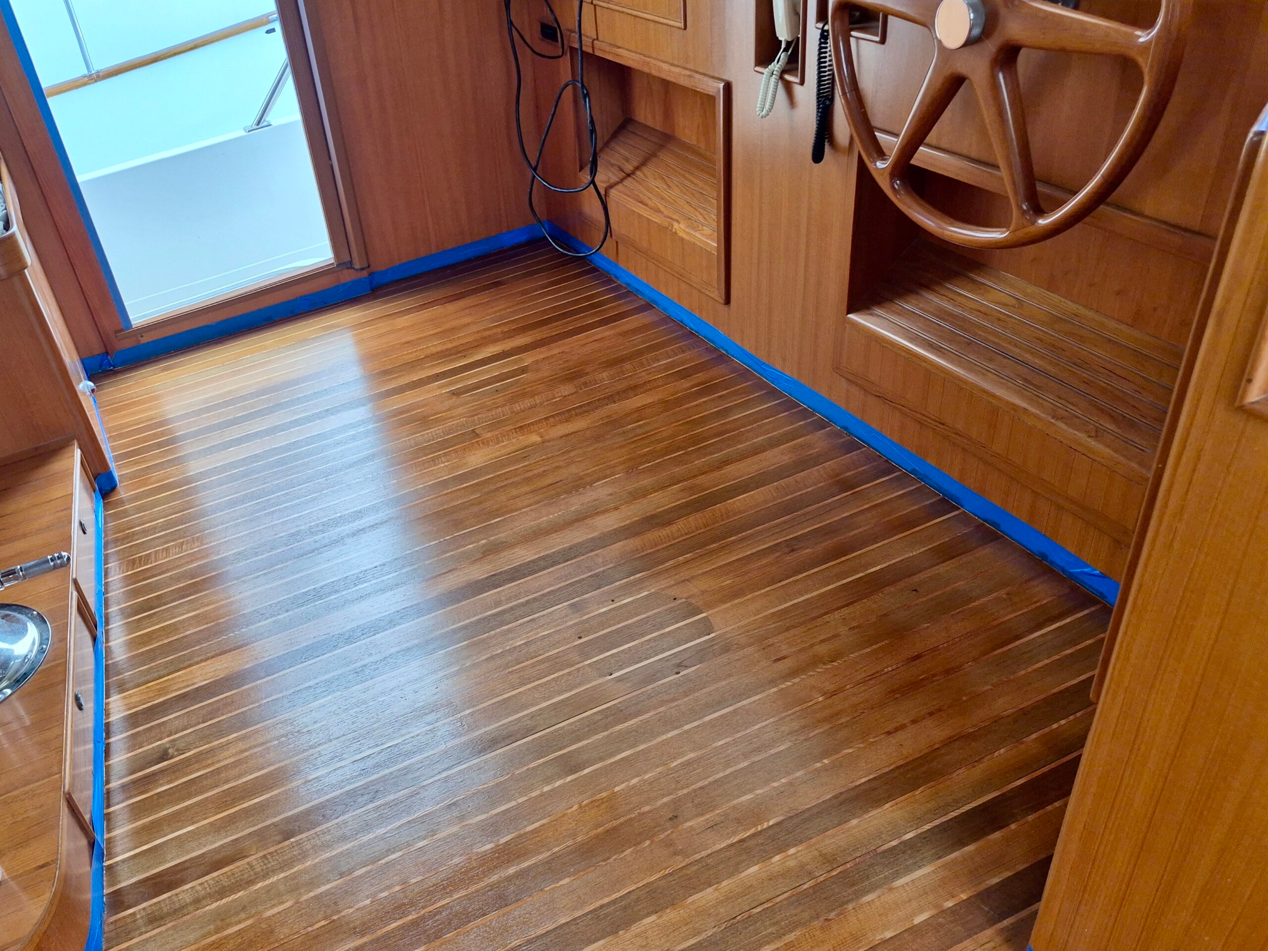 Pilot House Teak Flooring Taping During Yacht Carpentry Repair Refinishing, Port Charlotte.